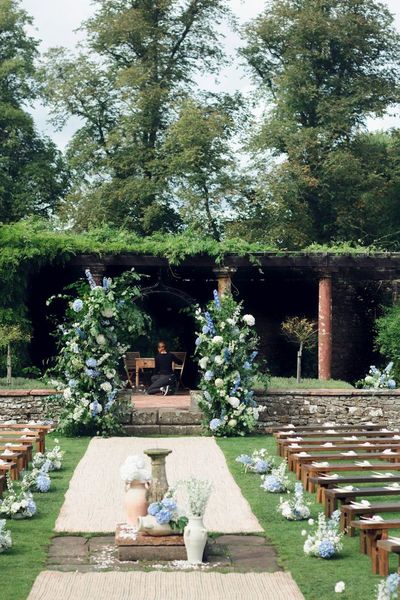 Blue and white wedding ceremony in the Italian garden - Photo credit: Jules Hefferon