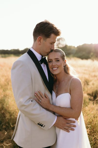 Black tie wedding couple during golden hour