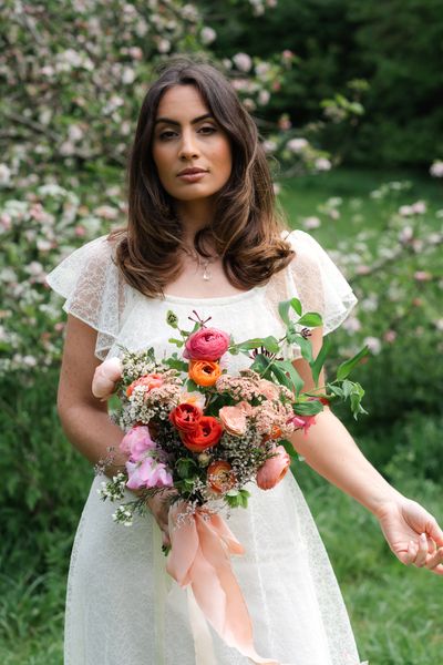 Spring bride in vintage wedding dress with colourful bouquet. Dress by Ashwell & Co, Photography by Wild Meadow