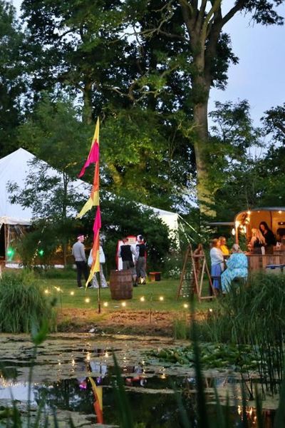 traditional pole marquee with festival flags and festoon lights