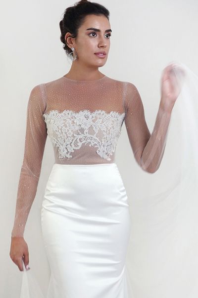 Stardust Dream is a silk crepe satin wedding dress with beaded French lace top and illusion glitter long sleeve, mermaid style. All photos credit to Margo