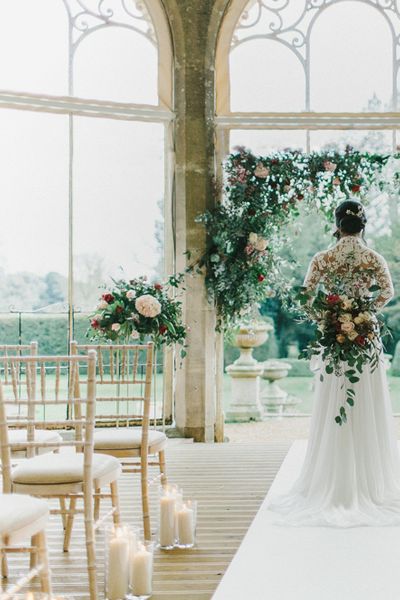 Blush & Burgundy Floral Fairytale Wedding at Grittleton House Planned & Styled by Jennifer Louise Weddings with Floral Arch. Katherine Yiannaki Photography