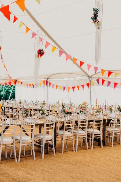 Colourful Bunting Wedding Decor for a Festival Themed Marquee Wedding with Fox Wedding Gown by Rue de Seine, shot by Peppermint Love Photography