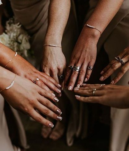 bridesmaids wearing matching silver bracelet as gift