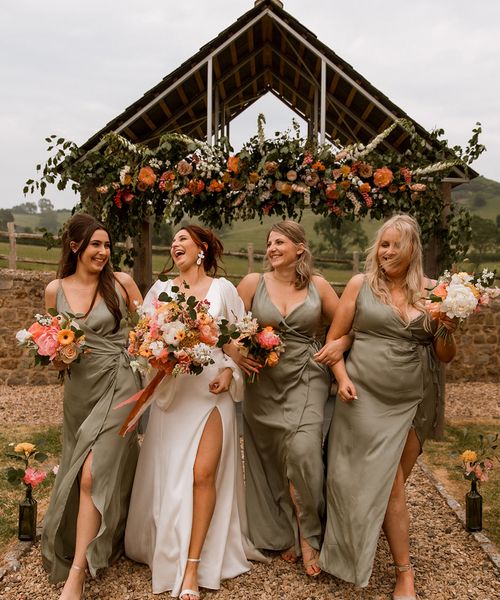 Hope Farm in Dorset wedding with bridesmaids in green dresses.