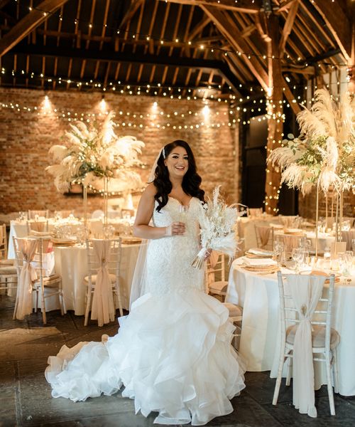 Intimate Cooling Castle Barn wedding with neutral colour scheme, dried flowers and fishtail wedding dress.