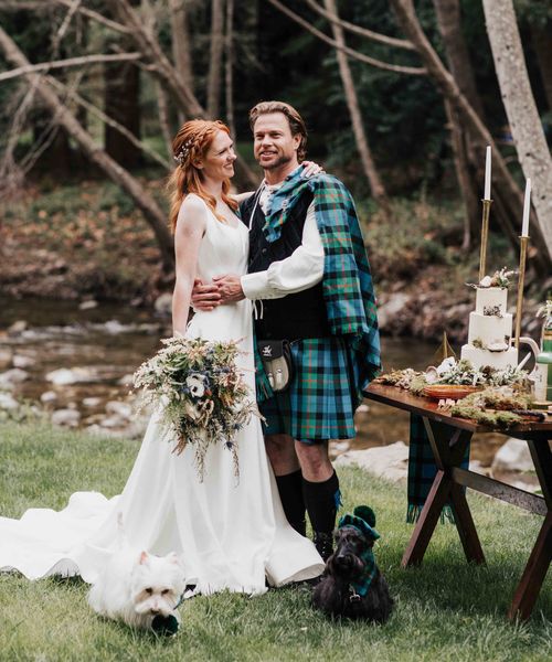 Scottish blue and green wedding inspiration with tartan kilts, a bagpiper, whiskey station and Scotty dogs.