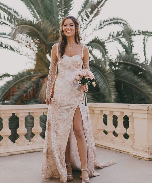 Carmen de los Mártires Spanish destination wedding with bespoke gold sparkly bridal gown with front slit