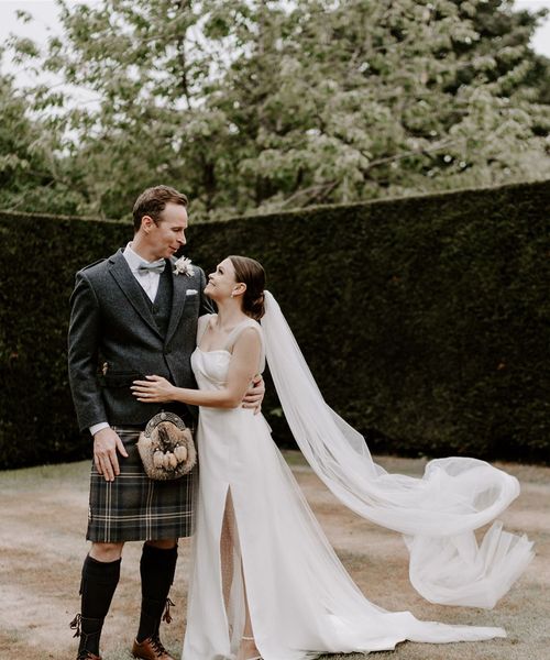 Pimhill Barn wedding with the groom in a kilt and bride in sparkly wedding dress.