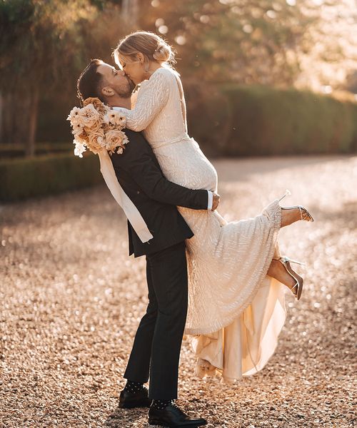 Bride and groom share a passionate and romantic kiss
