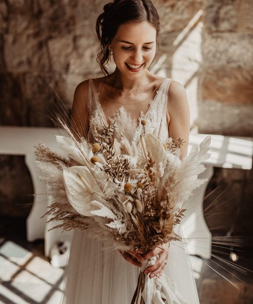 Bride with Dried Flower Wedding Bouquet