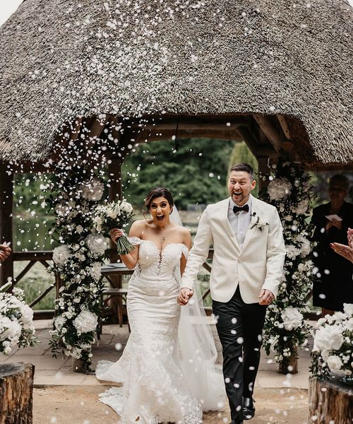 Bride and groom have confetti exit at The Orangery Kent.