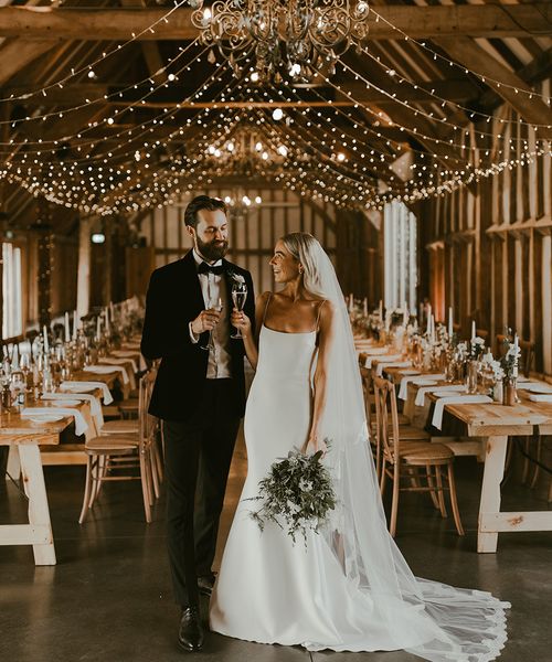 rustic barn wedding couple portrait for wedding insurance article