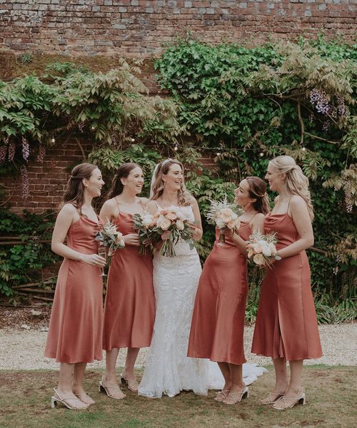 Bridal party wearing midi bridesmaid dresses