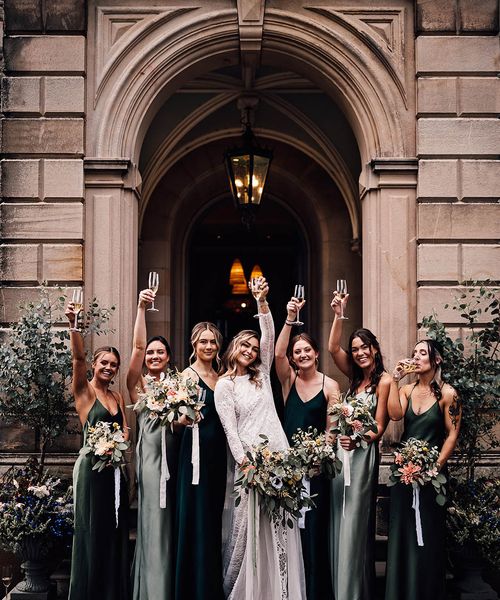 Bride with her bridesmaids in green bridesmaid dresses outside of Callow Hall.