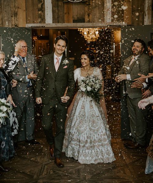 Wharfedale Grange wedding for multicultural couple as they exit to confetti