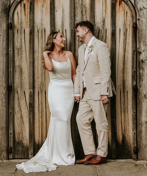 Shustoke Barns wedding with bride wearing a satin slip wedding dress