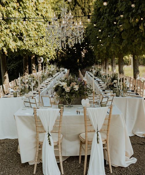 Sweetheart table for modern seating arrangement at outdoor wedding