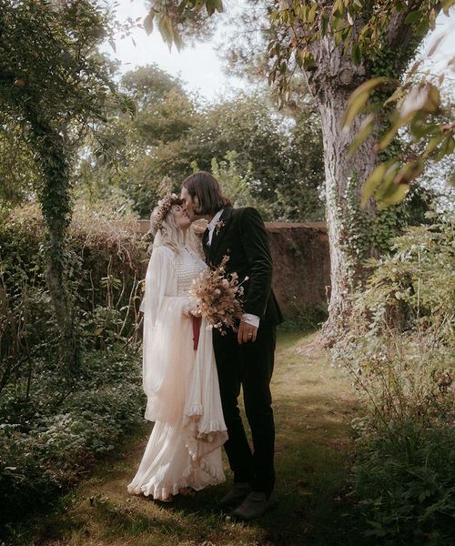 outdoor pagan wedding with vintage wedding dress and dried wedding flowers