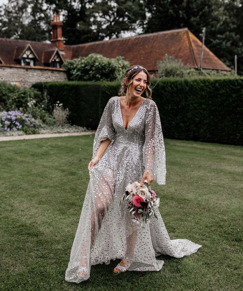 Silver sequin wedding dress, and gypsophila flower clouds for a marquee reception at home 