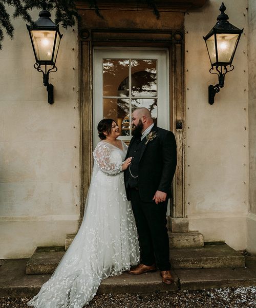 Groom in green tweed wedding suit with bride in lace dress at Aswarby Rectory.