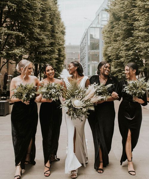 bridal-party-wearing-black-bridesmaid-dresses