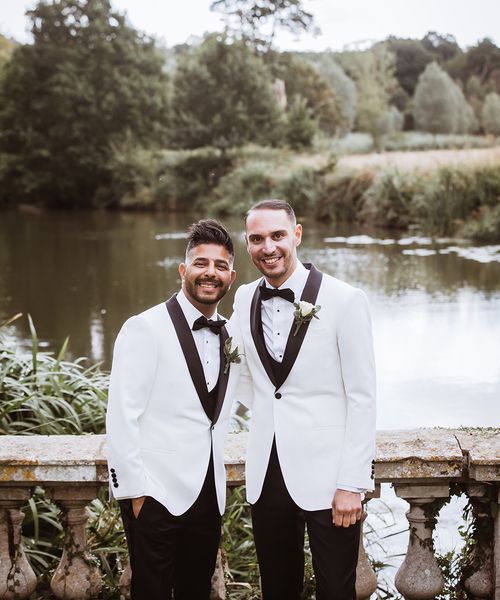 Braxted Park wedding with two grooms in matching white suit jackets