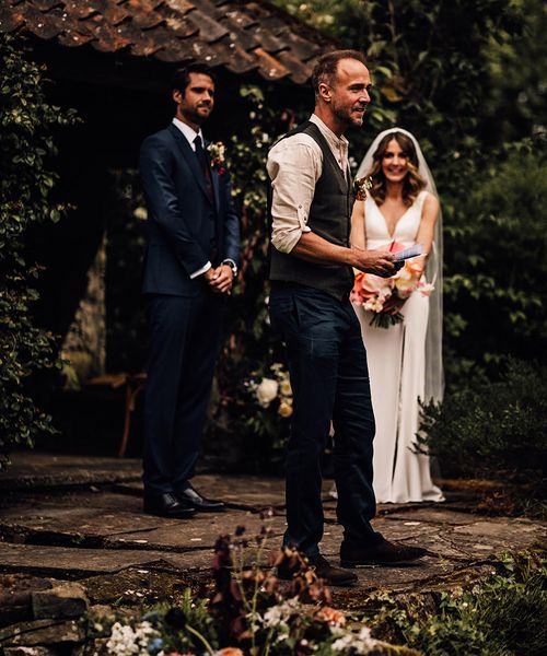 Guest gives a wedding reading from books.