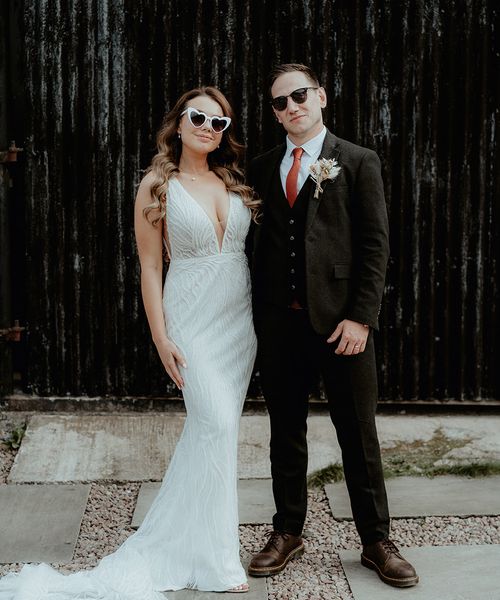 Bride in retro sunglasses with groom for wedding at Rhyse Farm.