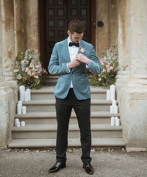 Groom in a blue velvet blazer for country house wedding