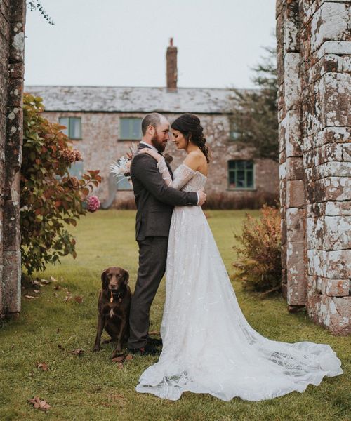 Bride in celestial and sparkly Zavana Couture wedding dress for rustic wedding. 