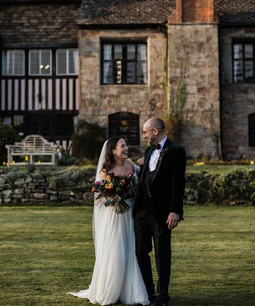 brinsop court manor house and barn wedding with smiling bride and groom.