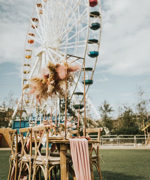 Pastel wedding inspiration at Dreamland Margate with astro slide, ferris wheel and outdoor reception with dried flowers