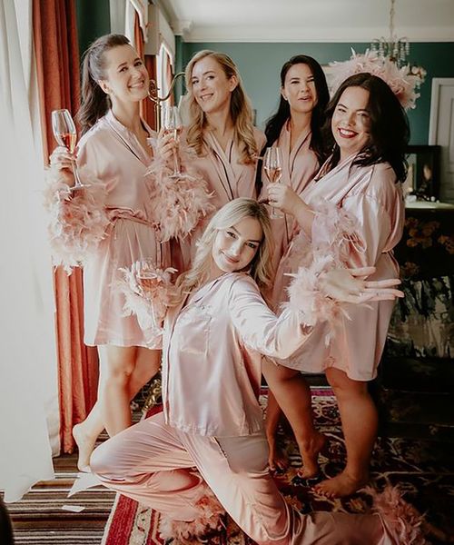 pink satin robes pjs with feathers The Kensingto Photographer