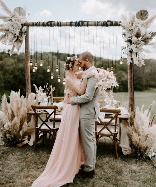 Boho luxe wedding inspiration at Waresley Park Estate with an outdoor reception, floral moon gate and blush wedding dress