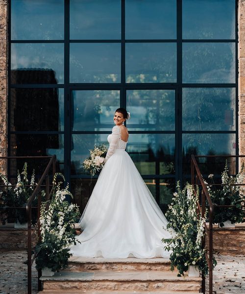 Bride in Emma Beaumont tulle princess wedding dress.