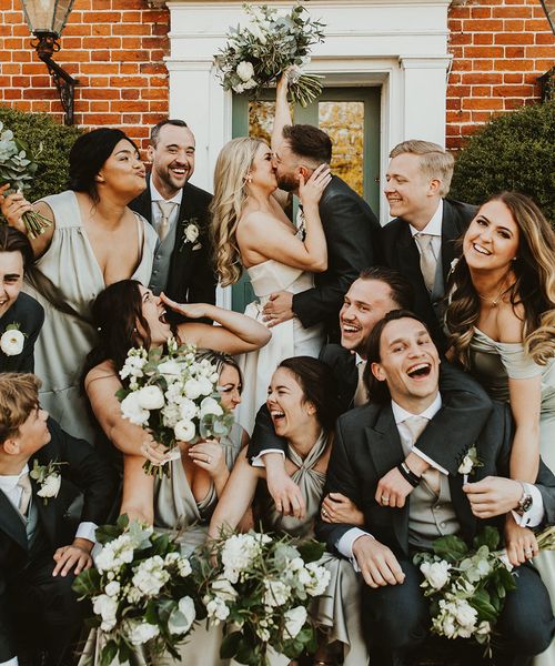 Villiers Barn wedding with the wedding party wearing green themed outfits