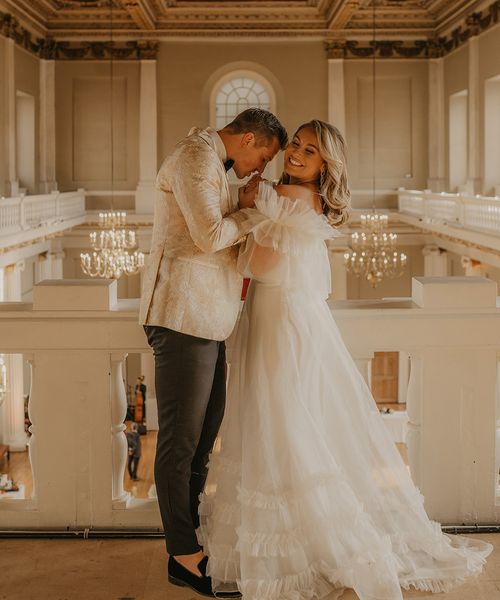 Banqueting House in Whitehall, London for American couple, Abbie and Kurt. Complete with Halfpenny London wedding dress and custom gold tuxedo.