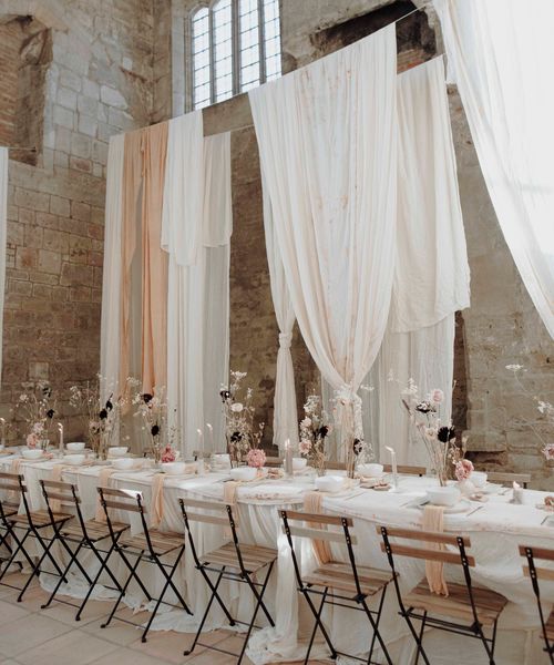 Blackfriars Priory gothic wedding inspiration with drapes, dried flowers and a concrete wedding cake.