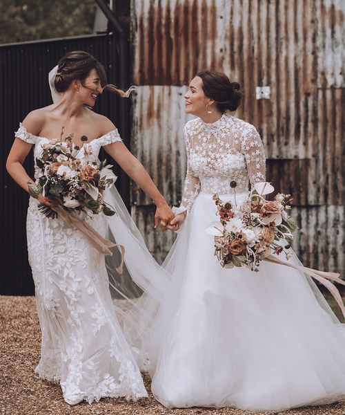 Stone Barn wedding with the brides in flower wedding dresses