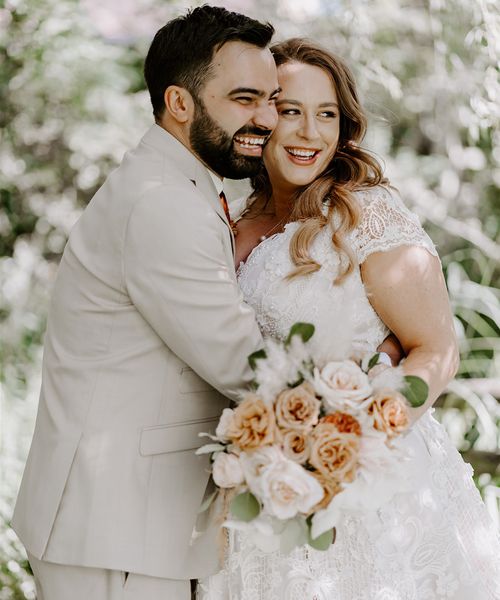 Bride and groom embrace for their weddings under 40k