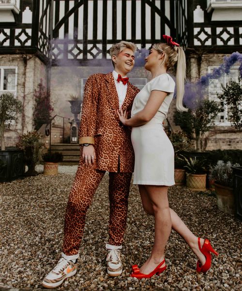 Pink and orange fun, retro LGBTQ+ wedding inspiration with roller skates, disco balls and a tulip bouquet by Lucy Dennis Photography