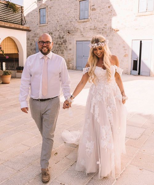 Bride and groom at their Croatia wedding with a boho theme.