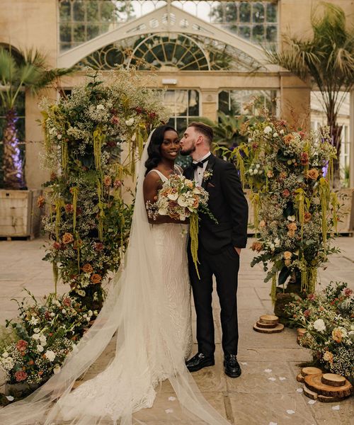 Syon Park wedding with black tie dress code, Nigerian money dance and flower columns