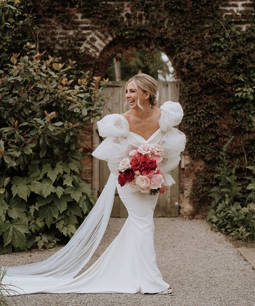 Red and pink wedding theme with the bride wearing a Chosen by Kyha wedding dress.