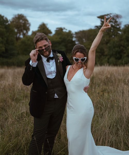 The Pear Tree Purton wedding with bride and groom wearing fun sunglasses.