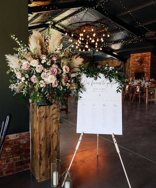 rustic barn wedding with wedding bouncy castle and sweet table