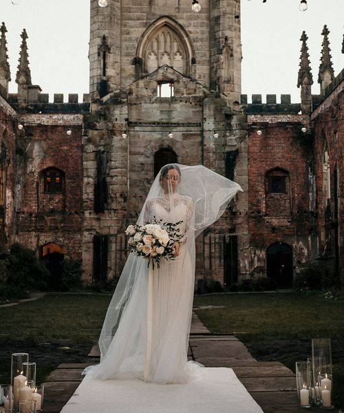 Wedding Inspiration at St Luke's Bombed Out Church in Liverpool with white flowers, festoon lights and drapes.