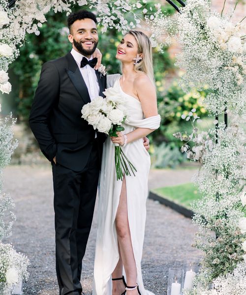 Sophisticated summer Garthmyl Hall wedding with white flowers and black-tie fashion