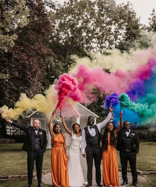 Hayne House wedding with black couple, orange bridesmaid dresses and colourful smoke bomb portraits 